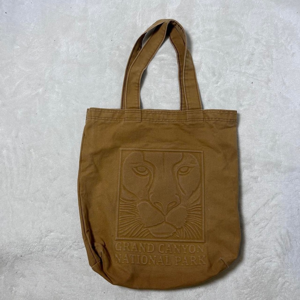 Grand Canyon National Park tote bag with embossed lion head design